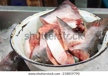 fish slice in old bowl for retail sale in local market