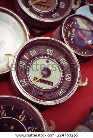old speedometer for sale in a native used-goods or secondhand trade market in chiang mai, thailand (post-process to be vintage style picture)