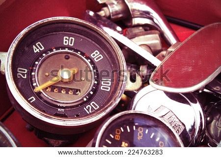 old speedometer for sale in a native used-goods or secondhand trade market in chiang mai, thailand (post-process to be vintage style picture)