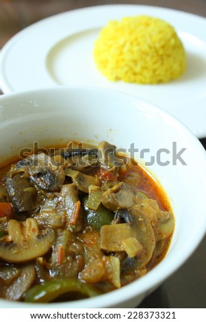indian mushroom curry, mushroom Dopiaza, vegetarian indian food with yellow cooked rice