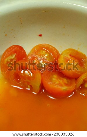 tomato in spicy curry soup. Thai style spicy curry.