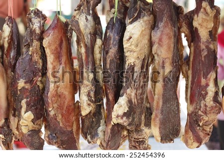smoked meat, dried meat, preserved meat hanging at local butchery