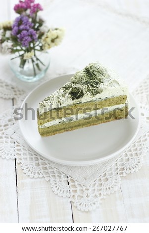 green tea cake on white wood background
