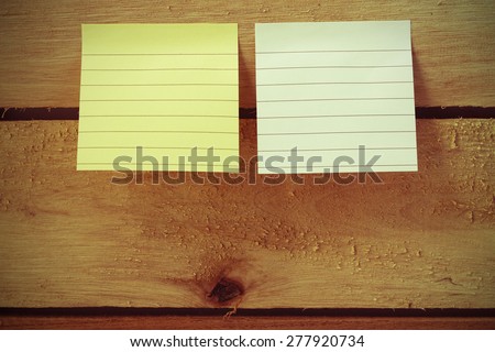 vintage colour style of note pad paper or note paper pasting on messy wooden panel