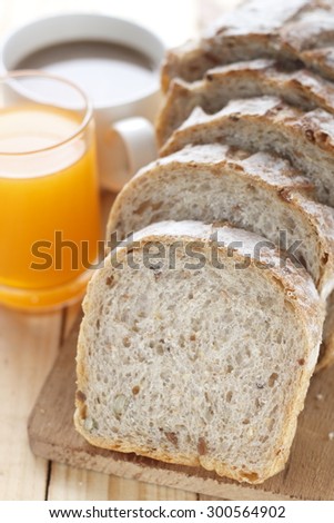 whole grain bread with a glass of orange juice and a cup of hot coffee for morning breakfast. morning breakfast.