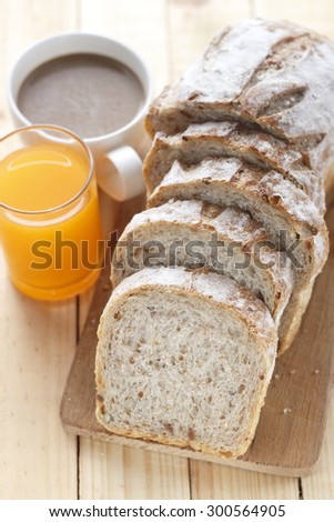 whole grain bread with a glass of orange juice and a cup of hot coffee for morning breakfast. morning breakfast.