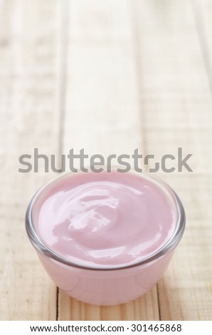 strawberry yogurt on wooden background. strawberry yoghurt. pink yogurt.