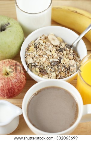 breakfast with banana cake, fruits, fruit juice, milk, coffee. healthy breakfast. breakfast on wooden background.