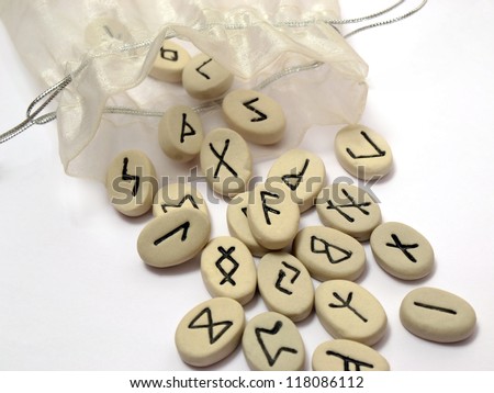 Fortune telling - nordic runes with symbols on stones