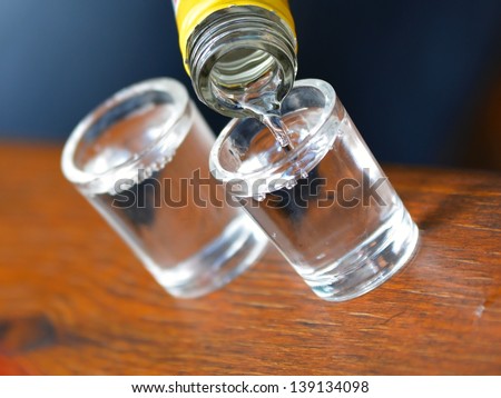 Alcohol vodka poured into a small glass