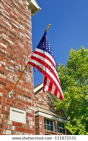Patriotic american flag in front of southern home