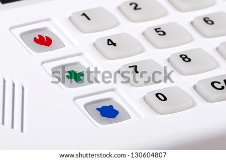 Home security alarm keypad, closeup of fire, police, and medical emergency buttons