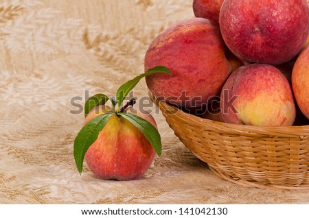 Fresh, juicy, peach fruits in a basket
