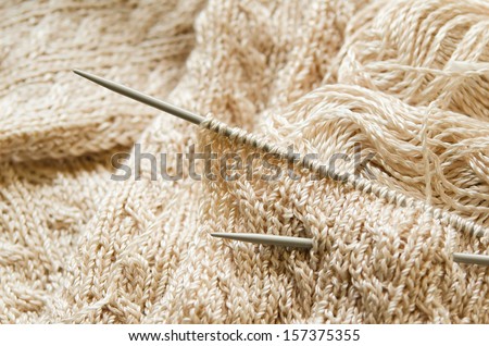 Knitting work in progress, knitting needles and yarn