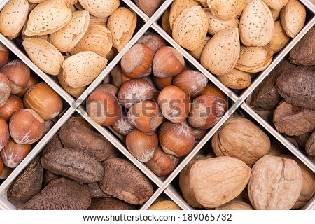 Mix nuts with almonds, walnuts, hazelnuts, and Brazil nuts in a wood soda crate