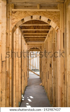 Unfinished residential construction house framing interior arch