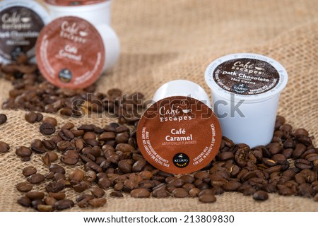 DALLAS, TX - JULY 30, 2014: Keurig Green Mountain Coffee single-serve K-Cups and coffee beans. Cafe Escapes is a collection of premium hot cocoas and dairy-based beverages available for Keurig brewer.