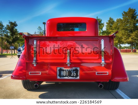 WESTLAKE, TEXAS - OCTOBER 18, 2014: A red 1935 Ford pickup truck is on display at the 4th Annual Westlake Classic Car Show. Rear view.