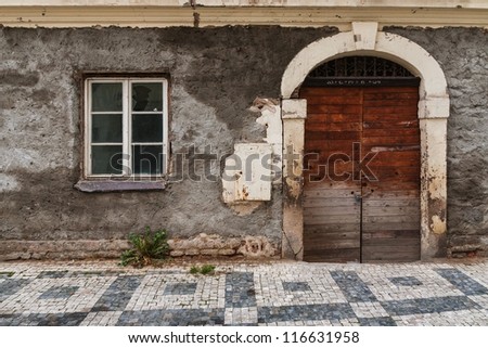 wet wall with broken door and windows
