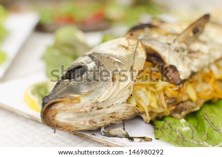 Close up view of prepared fish with vegetables