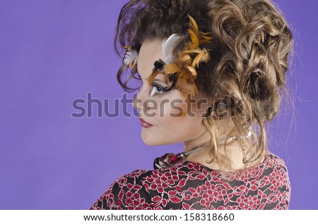 Studio portrait of a beautiful, charming ,attractive girl with art makeup in modern style