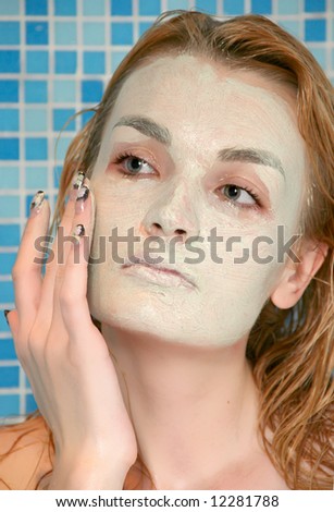 woman green face pack in shower