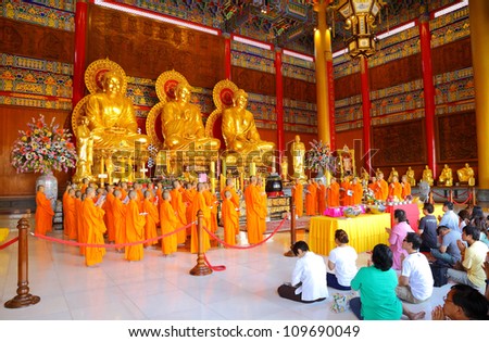 NONTHABURI, THAILAND - AUGUST 5 : Chinese monks and Chinese peoples show great faith by worship and pray to the Buddha in the morning at Leng Noei Yi 2 temple on August 5,2012 in Nonthaburi, Thailand