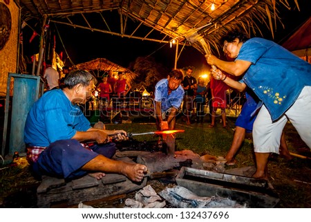 AYUTTHAYA,THAILAND-MARCH 17: The Folk have beating sheet of hot steel to make the sword in Thai ancient style at Mahathat temple on March 17,2013 in Ayutthaya,Thailand
