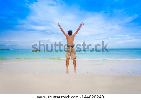 Happy man with beautiful sea and sky for abstract/background use