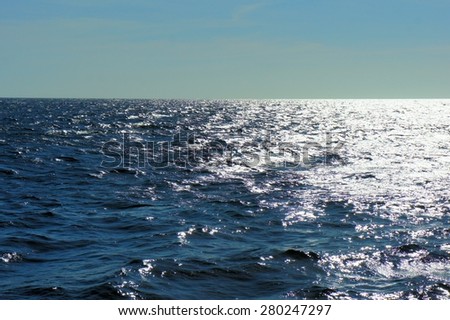 South Sea. Blue waves. The sun glitters on the waves. Philippines.