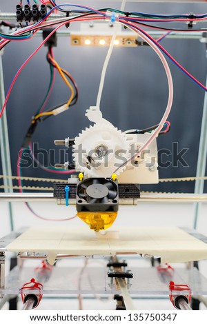 Electronic three dimensional plastic printer during work in school laboratory, 3D printer, 3D printing