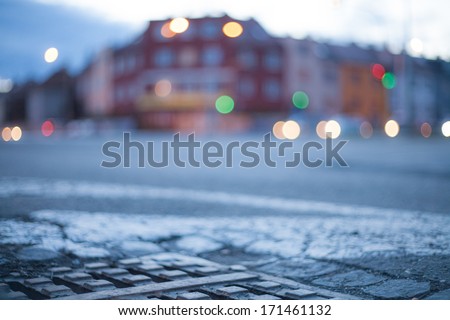 Blurred background - night street with street lights, great for design.