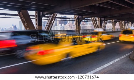taxi on Queensboro Bridge and New York City Manhattan on background