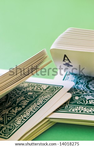 close-up of playing cards shuffled with an ace
