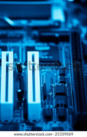 PC motherboard blue toned with shallow depth of field