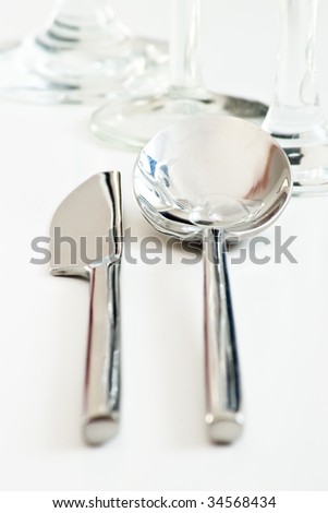 table knife and spoon on white