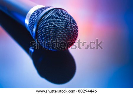 microphone with reflection in mixed red blue light
