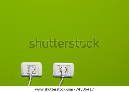 electric consumption - two socket on green wall