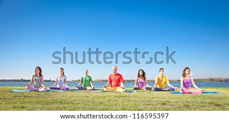 Group of young people have meditation on yoga class