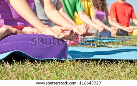 Detail of people in Yoga lotus position. Yoga concept.