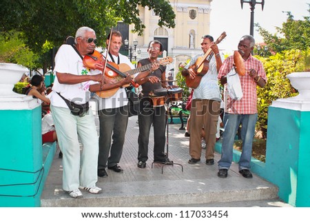 SANTIAGO-JAN. 21:Street musicians on January 21, 2010 in Santiago,Cuba.With the expansion of tourism,many cubans earn their lives working for tourists as street performers playing traditional music