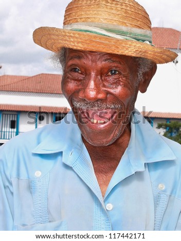 Old sympathetic cuban man with straw hat make a funny face, Santiago de Cuba, Cuba