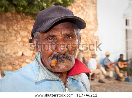 TRINIDAD,CUBA-JANUARY12:Unidentified Cuban smoking cigar on January 12. 2010.Trinidad,Cuba.Cubans of all ages are actively smoking cigars.All production in Cuba is controlled by the Cuban government.