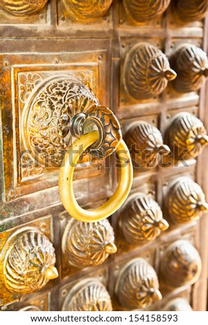Bronze antique drawer door handle on Mani Keshar Chowk at Durbar Sqaure in Patan, Lalitpur city,  Nepal.