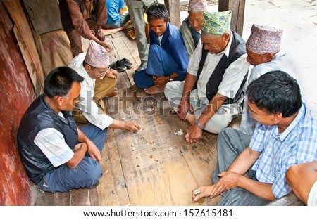 BHAKTAPUR-MAY 20:Unidentified men playing traditional game on May 20,2013 in Bhaktapur, Nepal.Games with bamboo stick and rock have been played in most cultures and societies throughout history.