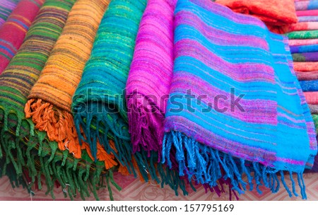 Pile of gentle folded shawls (scarfs) at the market, Pokhara, Nepal.