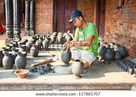 BHAKTAPUR, NEPAL - MAY 20 : Unidentified man is molding the pot on May 20, 2013 in Bhaktapur, Nepal. Bhaktapur is listed as a World Heritage by UNESCO for its rich culture, temples, and wood artwork.