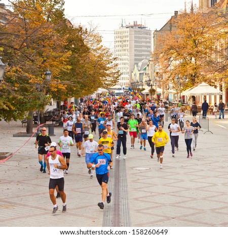 NOVI SAD, SERBIA - OCTOBER 13: Unidentified runners on the street during Novi Sad autumn Marathon on October 13, 2013 in Novi Sad, Serbia