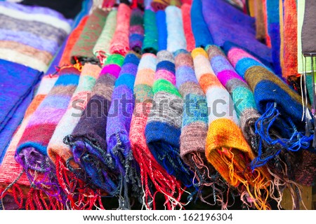 Pile of gentle folded shawls (scarfs) at the market, Pokhara, Nepal.