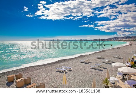 View of the beach in Nice, near the Promenade des Anglais, on summer hot day, France.
